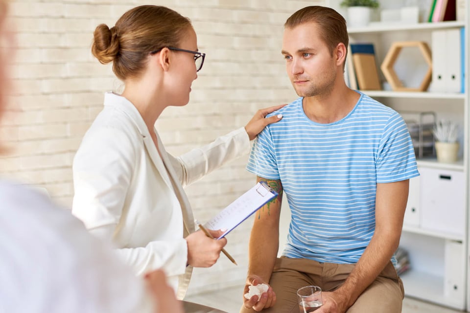 young-man-crying-in-support-group-BWMTJP3-(1)